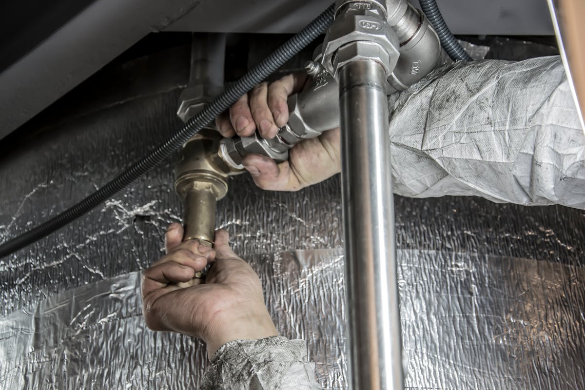 HVAC technician performing professional heating and cooling service for residential customer