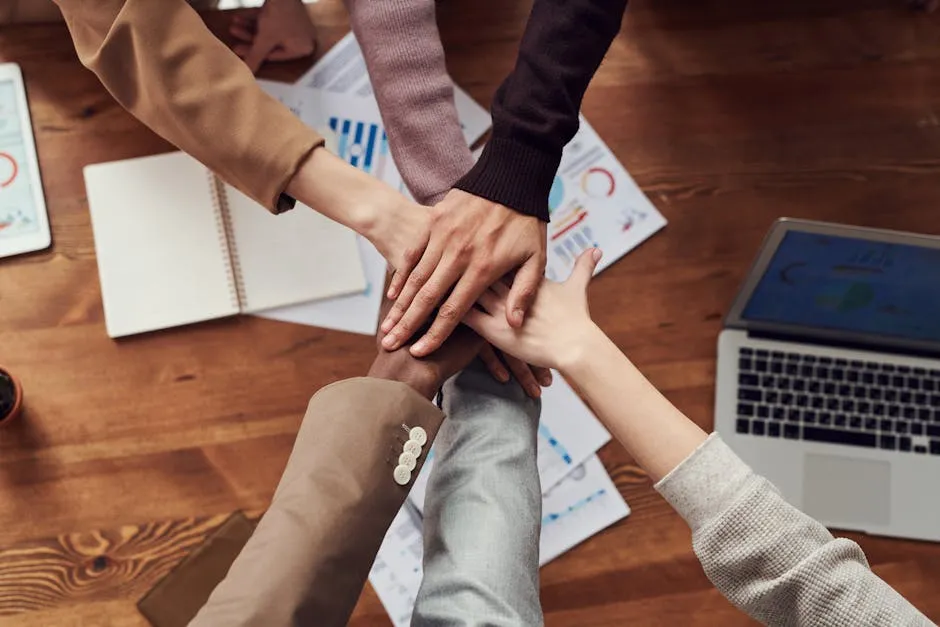 Business professionals shaking hands after successful deal